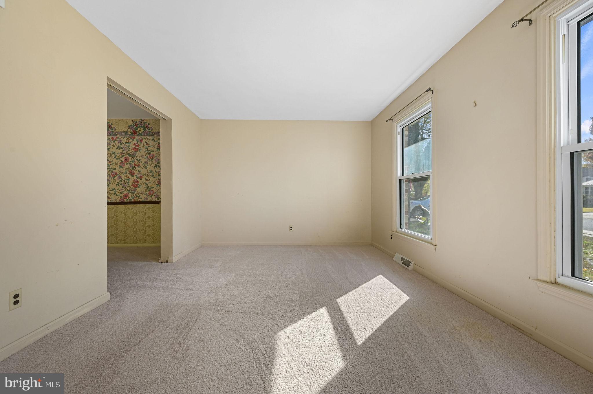 210 Cambridge Road Camden Wyoming, DE 19934 - Photo 4 of 35 an empty room with windows