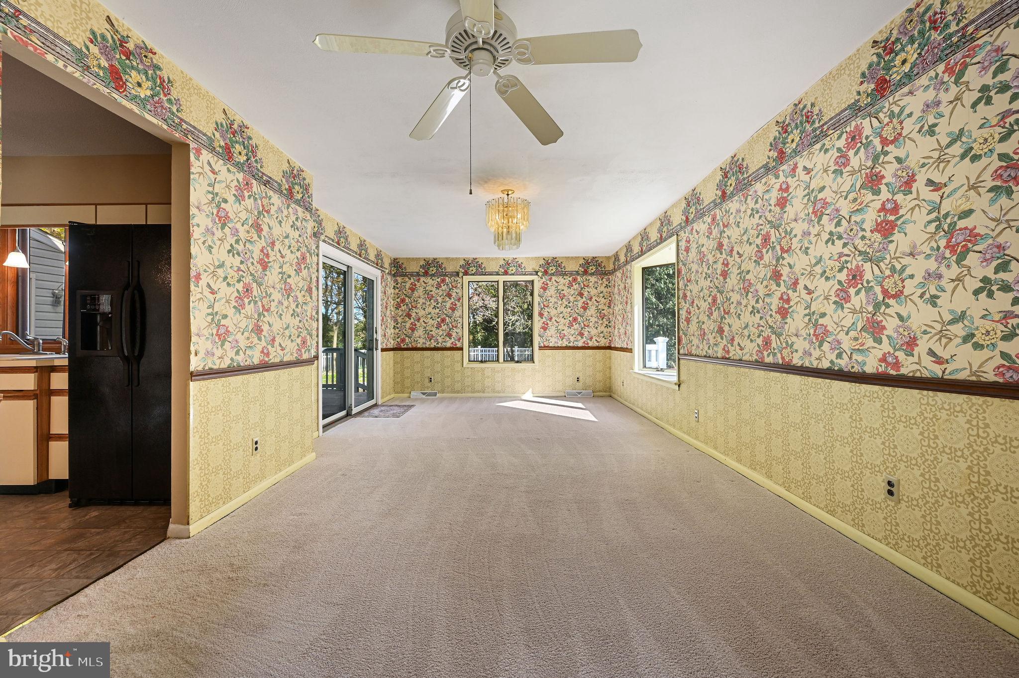 210 Cambridge Road Camden Wyoming, DE 19934 - Photo 9 of 35 a view of hallway with furniture and a chandelier