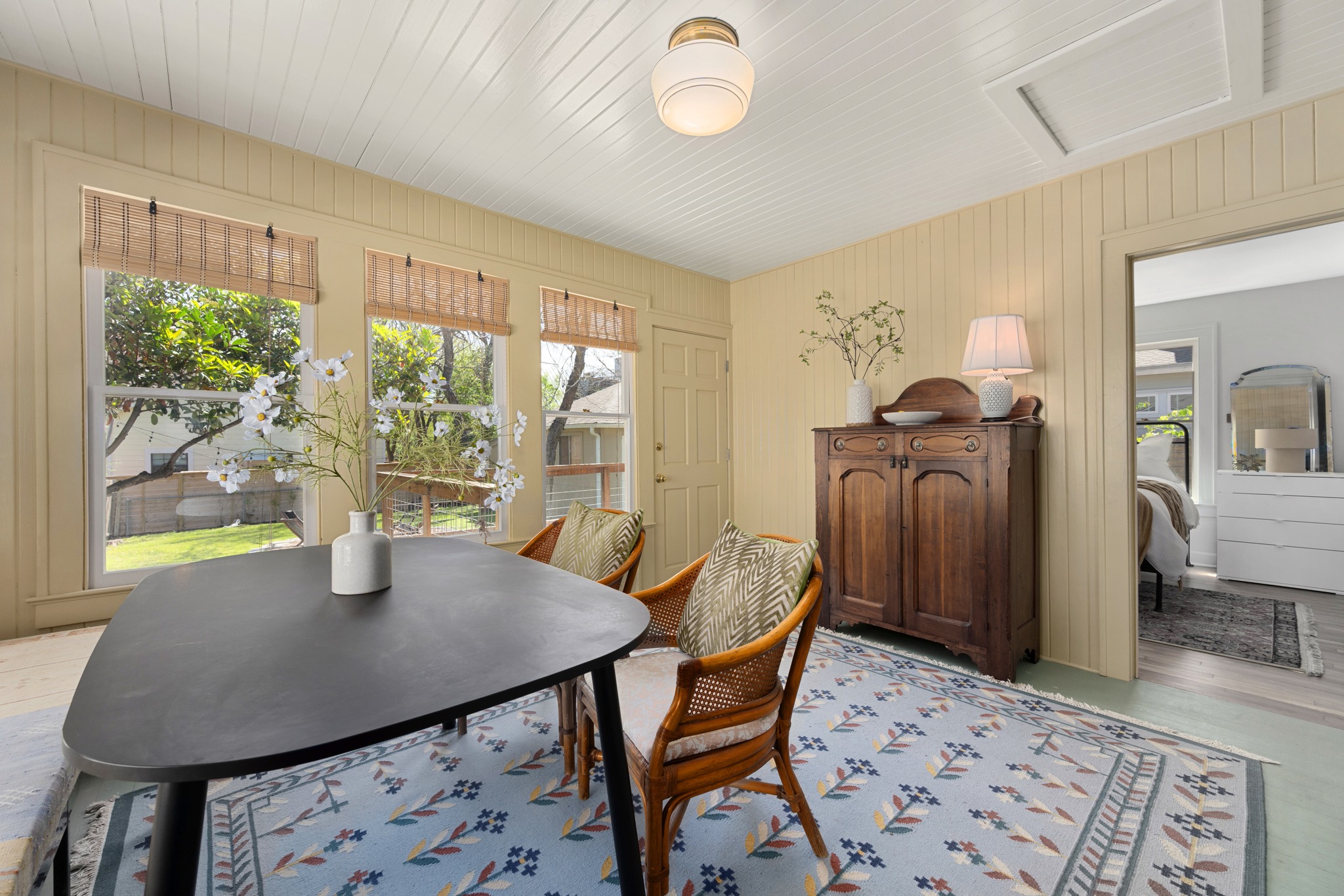 3909 Becker Avenue Austin, TX 78751 - Photo 17 of 38 Dining space with plenty of natural light, light wood finished floors, and wood walls