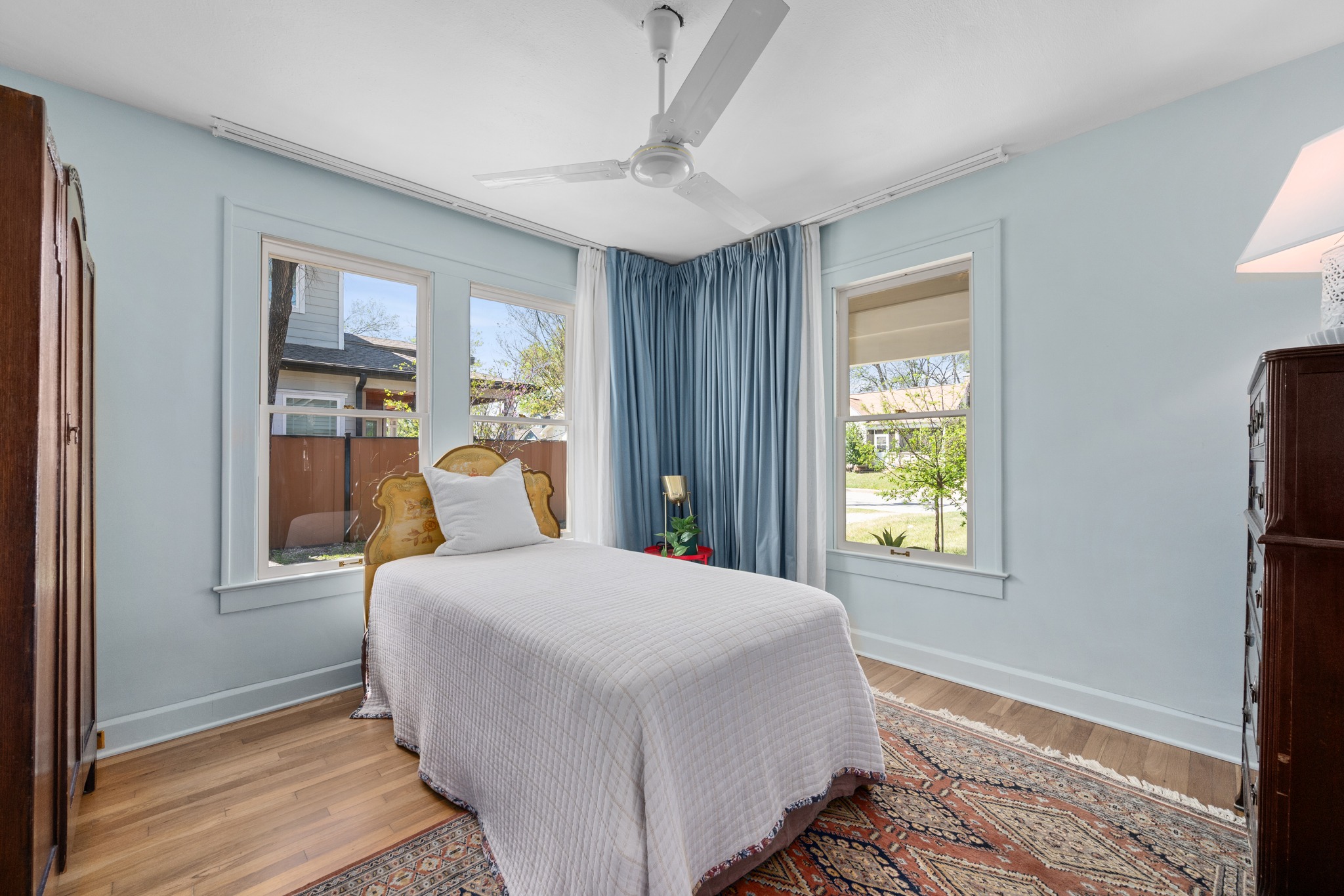 3909 Becker Avenue Austin, TX 78751 - Photo 18 of 38 Bedroom with light wood-style floors and a ceiling fan