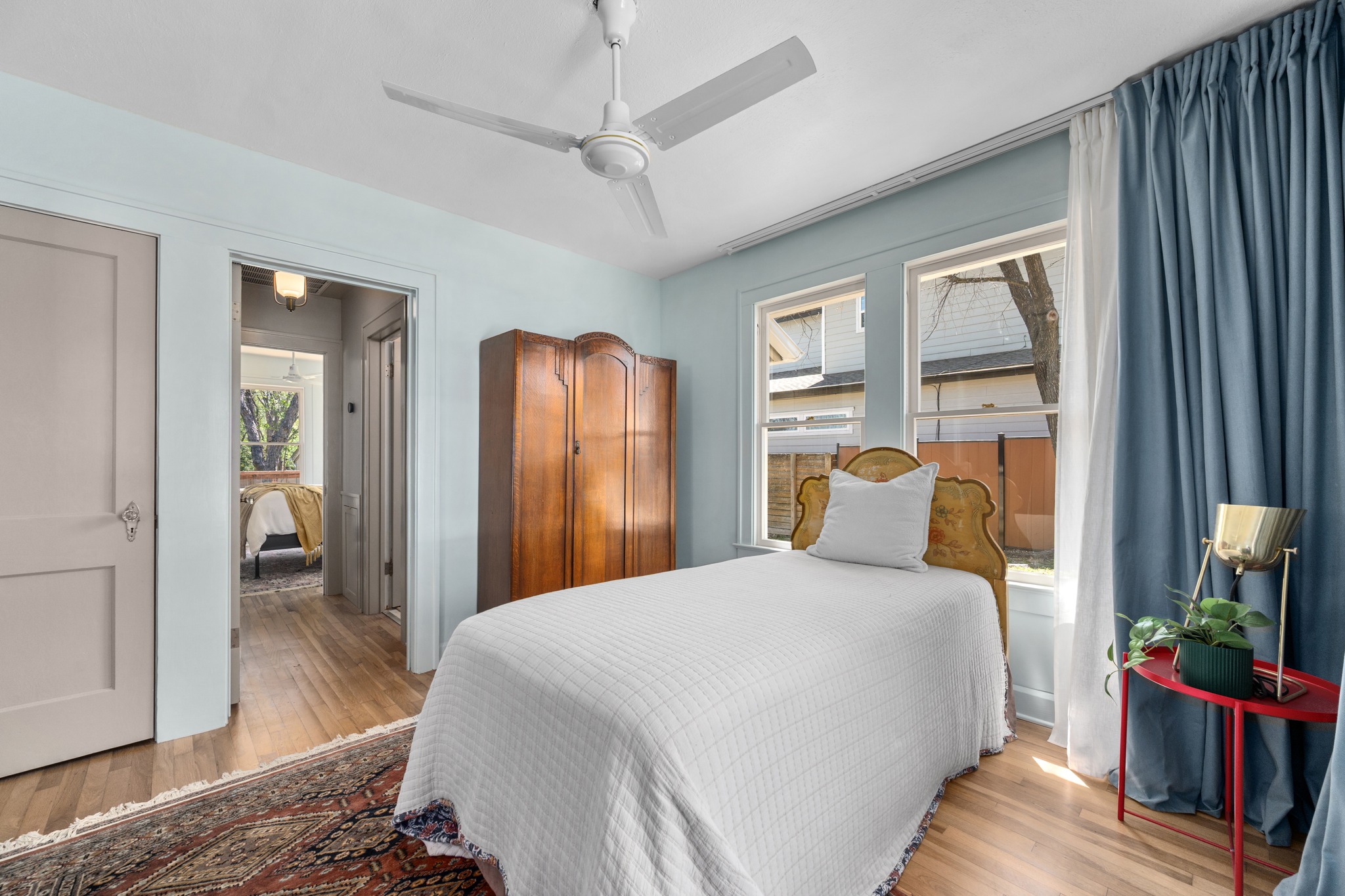 3909 Becker Avenue Austin, TX 78751 - Photo 19 of 38 Bedroom with light wood finished floors and ceiling fan