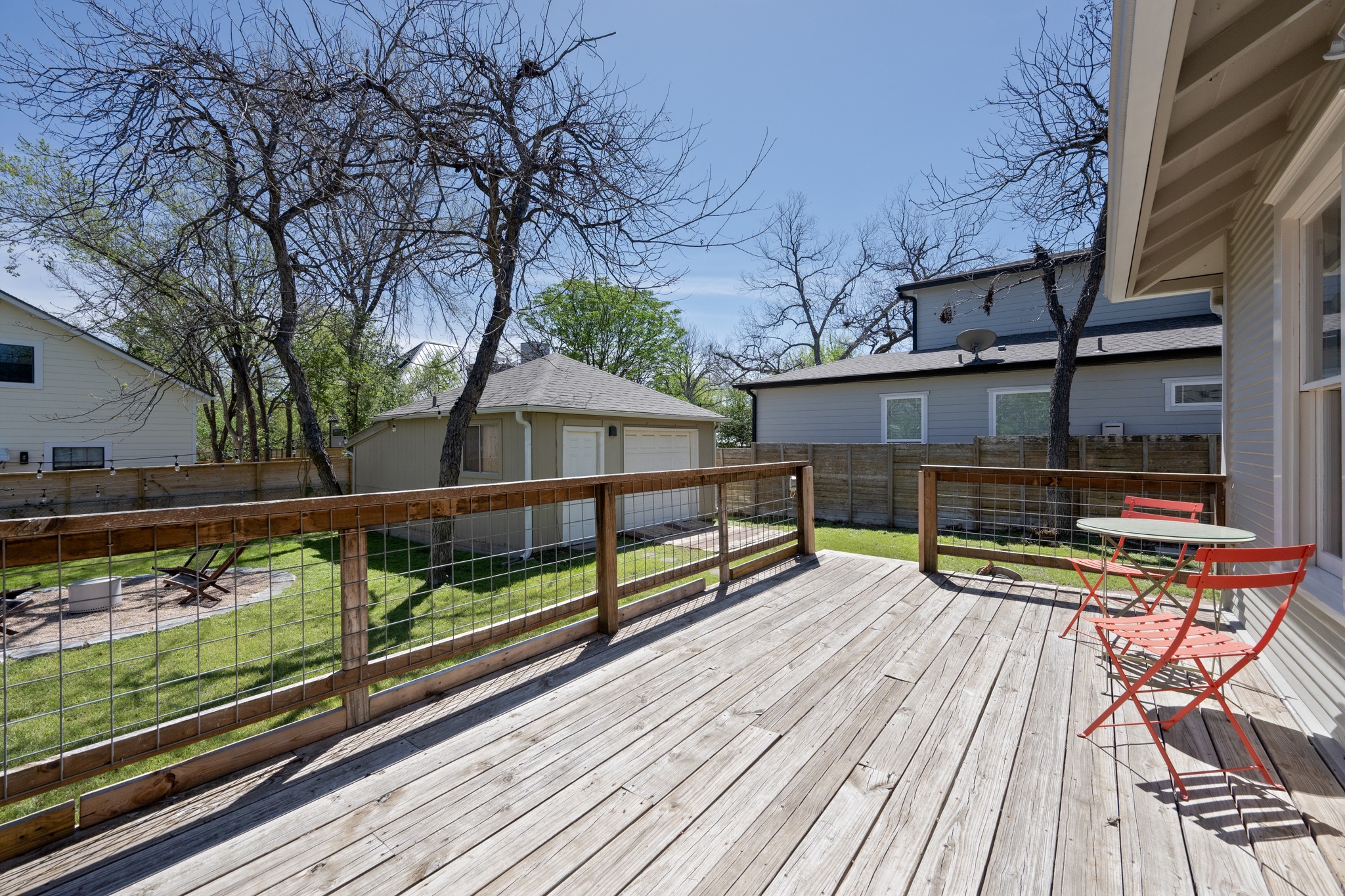 3909 Becker Avenue Austin, TX 78751 - Photo 23 of 38 Wooden deck with a detached garage, an outbuilding, and a fenced backyard