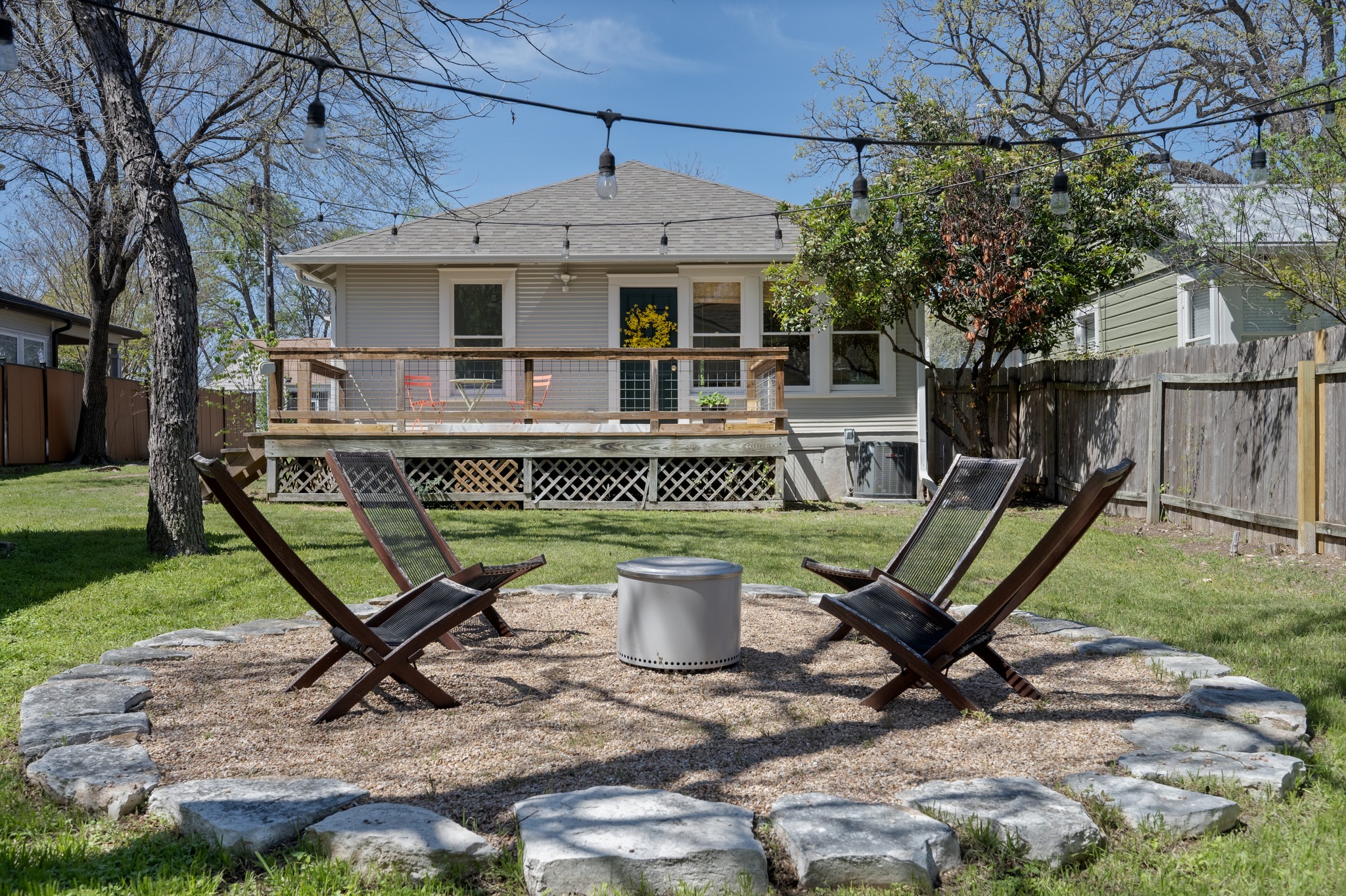 3909 Becker Avenue Austin, TX 78751 - Photo 28 of 38 Back of house with a fenced backyard, a wooden deck, and roof with shingles