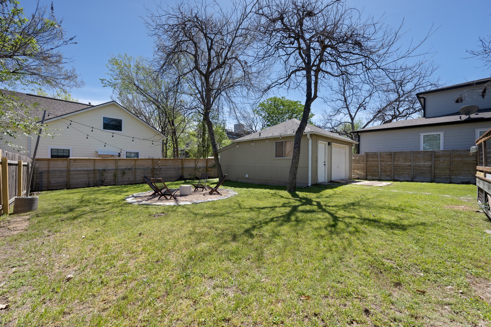 3909 Becker Avenue Austin, TX 78751 - Photo 30 of 38 Fenced backyard with a patio and an outbuilding