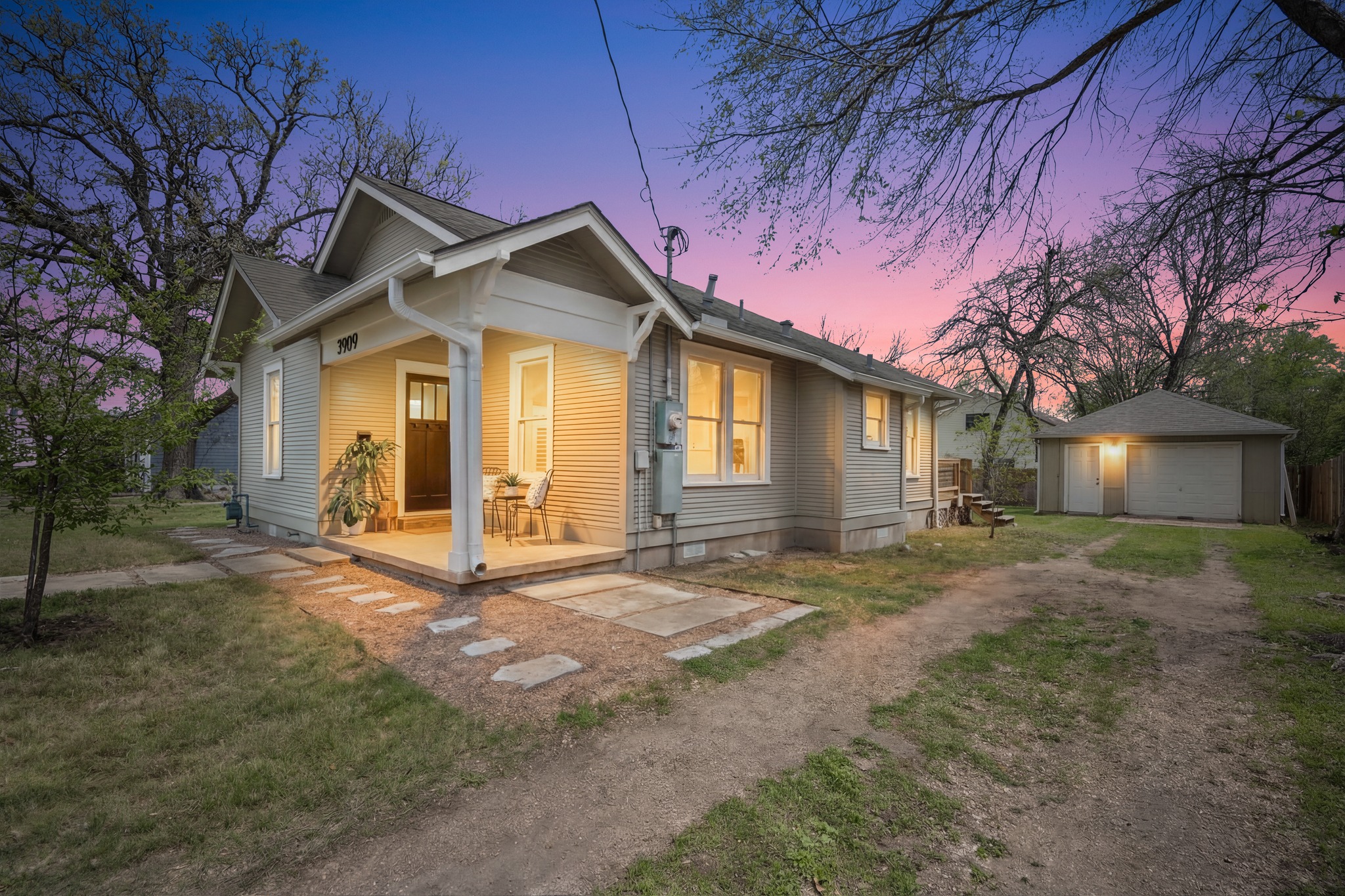 3909 Becker Avenue Austin, TX 78751 - Photo 4 of 38 View of front of house featuring an outdoor structure, a garage, driveway, crawl space, and a front yard