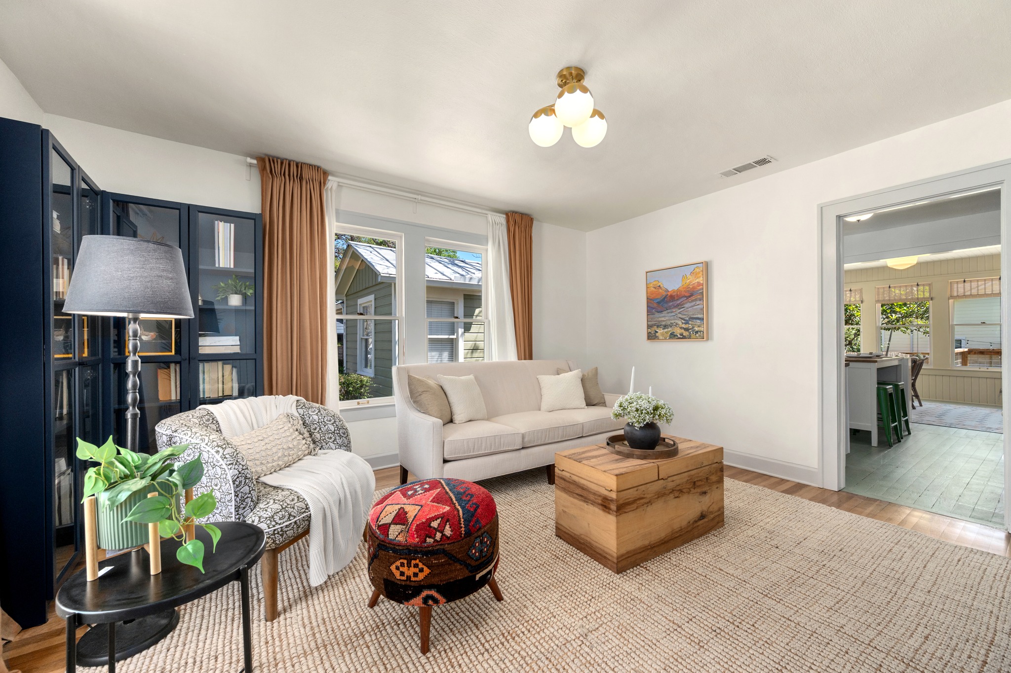 3909 Becker Avenue Austin, TX 78751 - Photo 7 of 38 Living room with wood finished floors and healthy amount of natural light