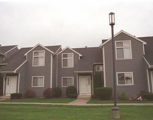 12 April Gardens Road, Unit C Seymour, CT 06483 - Photo 1 of 1 a front view of a house with a yard