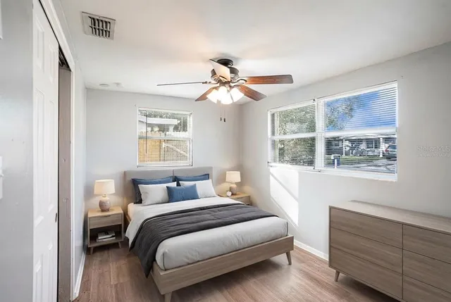 a bedroom with a bed and a window