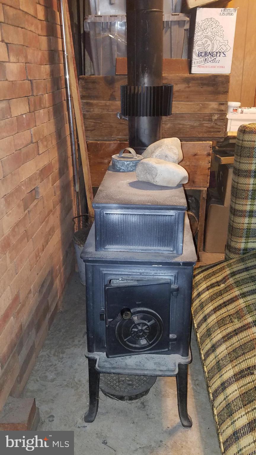 2025 Springer Road Harleysville, PA 19438 - Photo 17 of 29 Woodstove in basement room