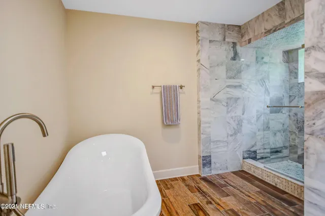 a bathroom with a sink and shower