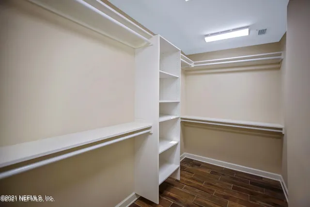 a view of an empty walk in closet