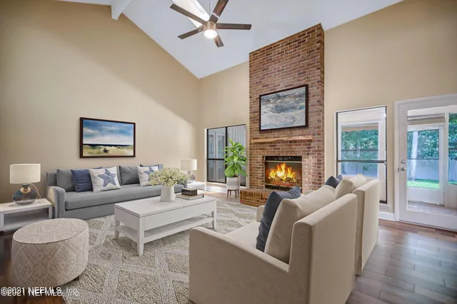 a living room with furniture and a fireplace