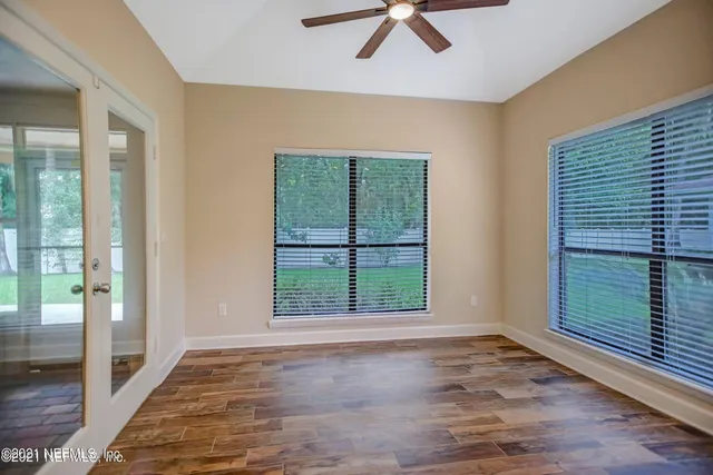 a view of an empty room with a window
