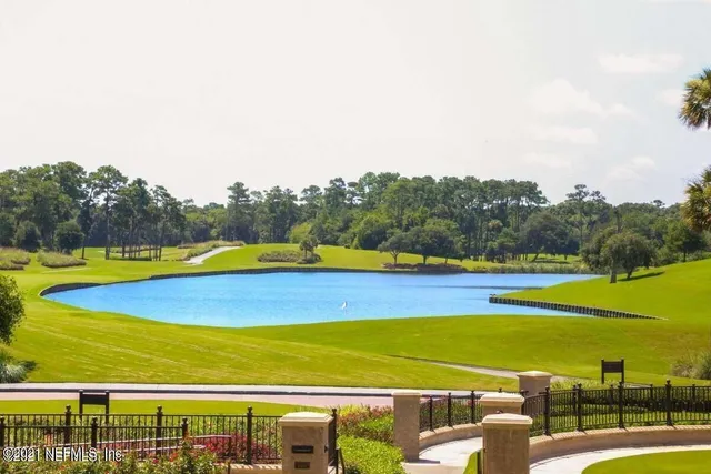 a view of swimming pool with an outdoor seating and yard