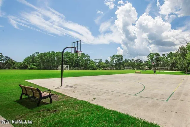 a park view with a bench in garden