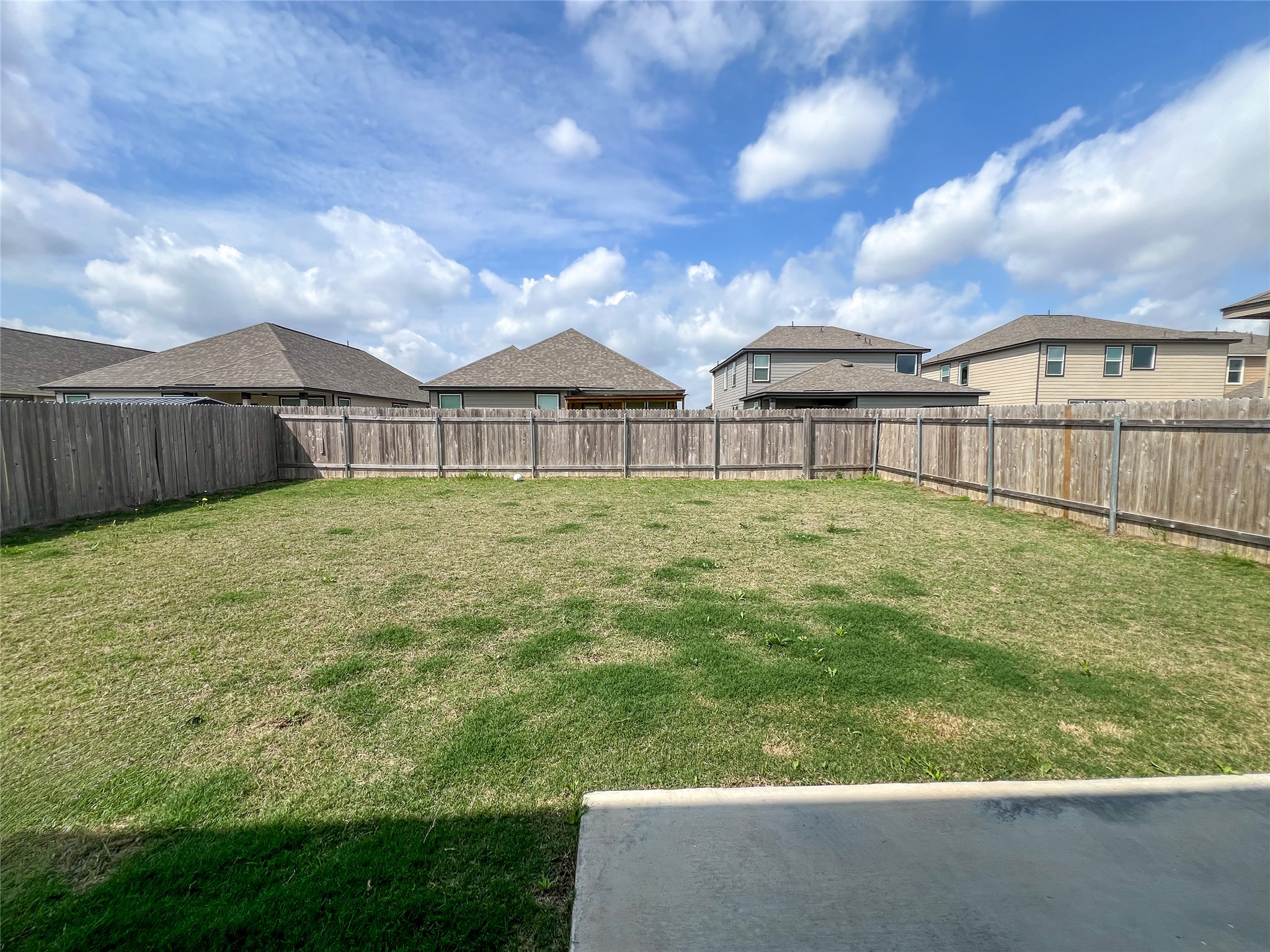 221 Summit Drive Lockhart, TX 78644 - Photo 15 of 16 a view of a house with a yard and sitting area