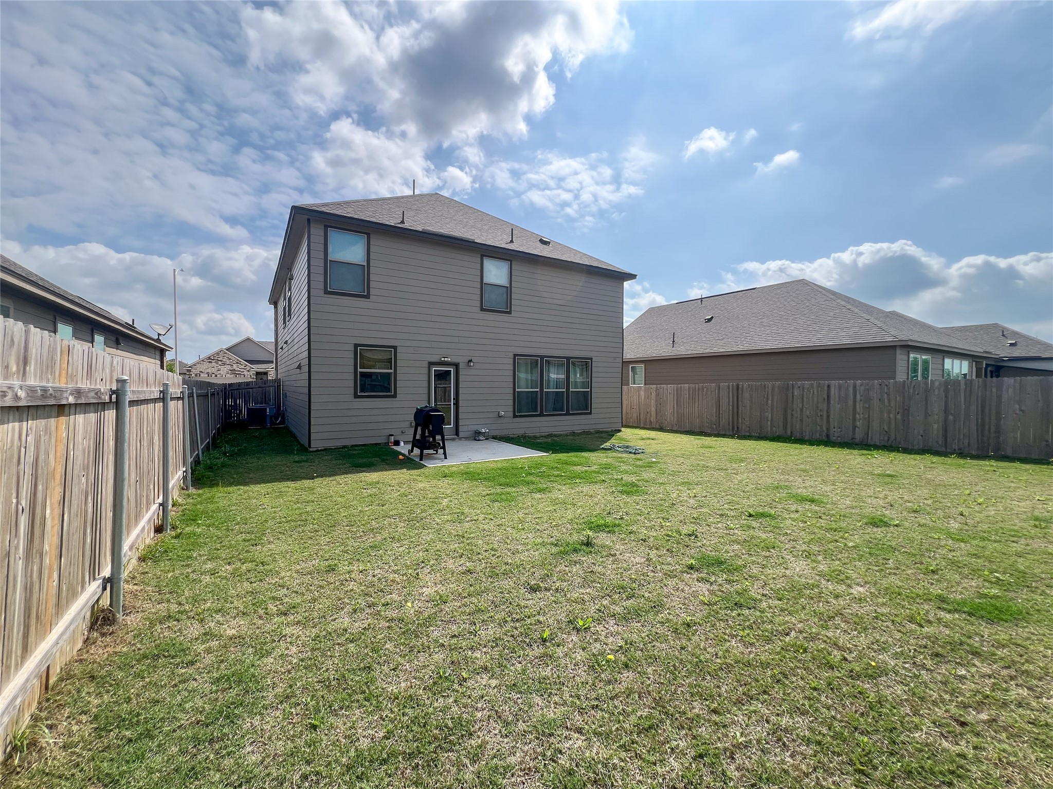 221 Summit Drive Lockhart, TX 78644 - Photo 16 of 16 a view of a house with backyard and garden