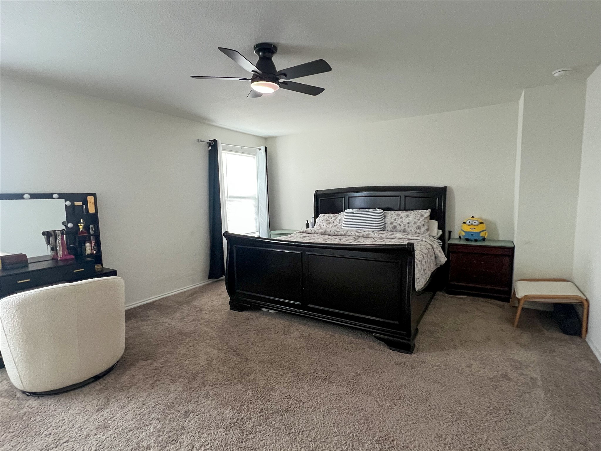 221 Summit Drive Lockhart, TX 78644 - Photo 6 of 16 a bedroom with a bed and a chandelier