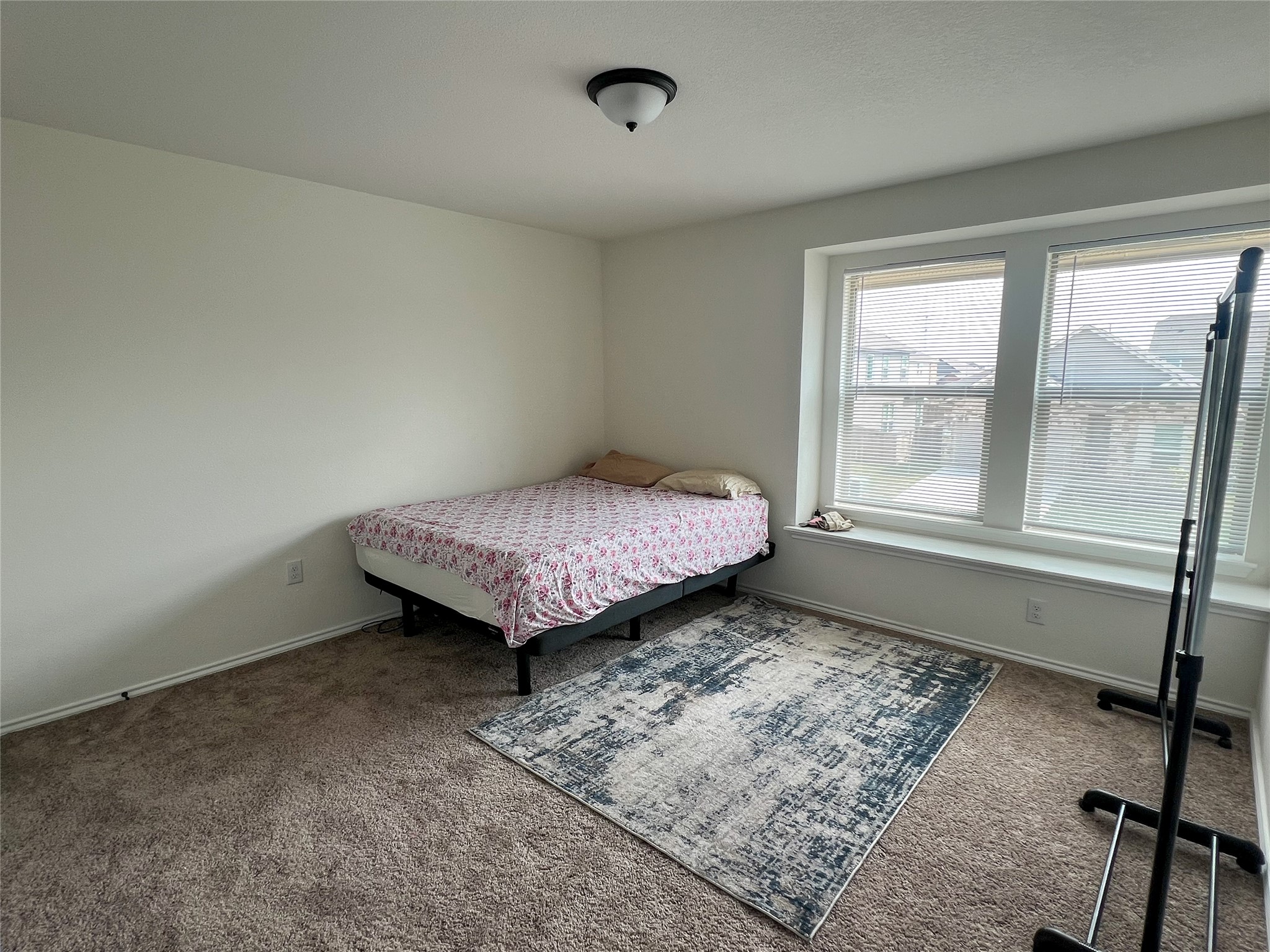221 Summit Drive Lockhart, TX 78644 - Photo 8 of 16 a bedroom with a bed and wooden floor