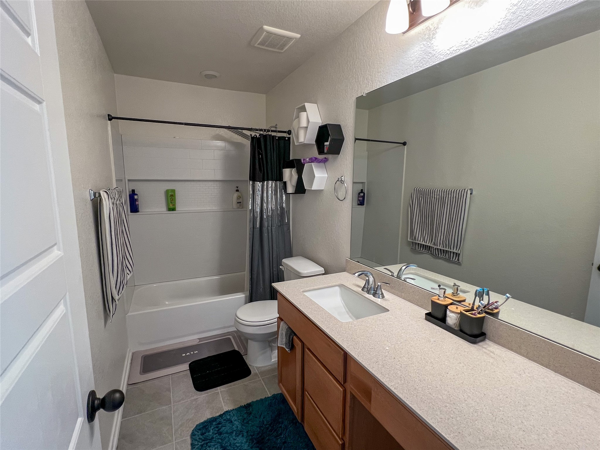221 Summit Drive Lockhart, TX 78644 - Photo 10 of 16 a bathroom with a sink toilet and shower
