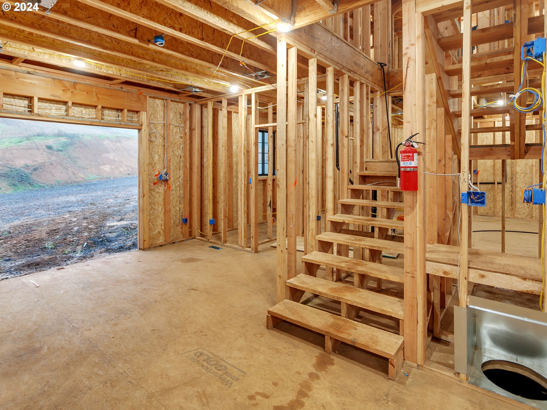 27778 Briggs Hill Road Eugene, OR 97405 - Photo 4 of 25 a view of staircase with building and refrigerator