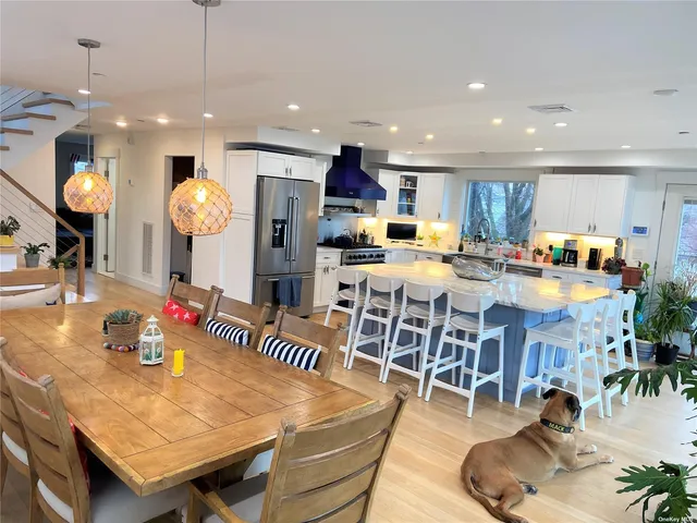 a large kitchen with lots of counter space and stainless steel appliances