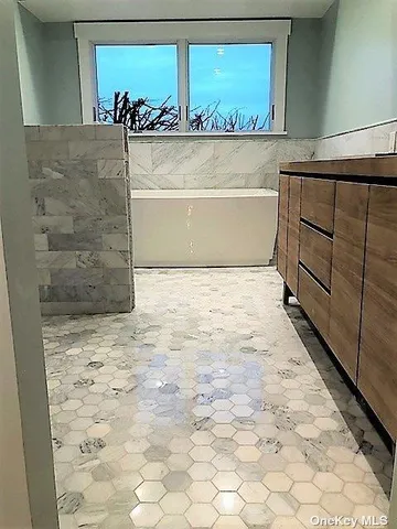 a view of a bathtub in a room
