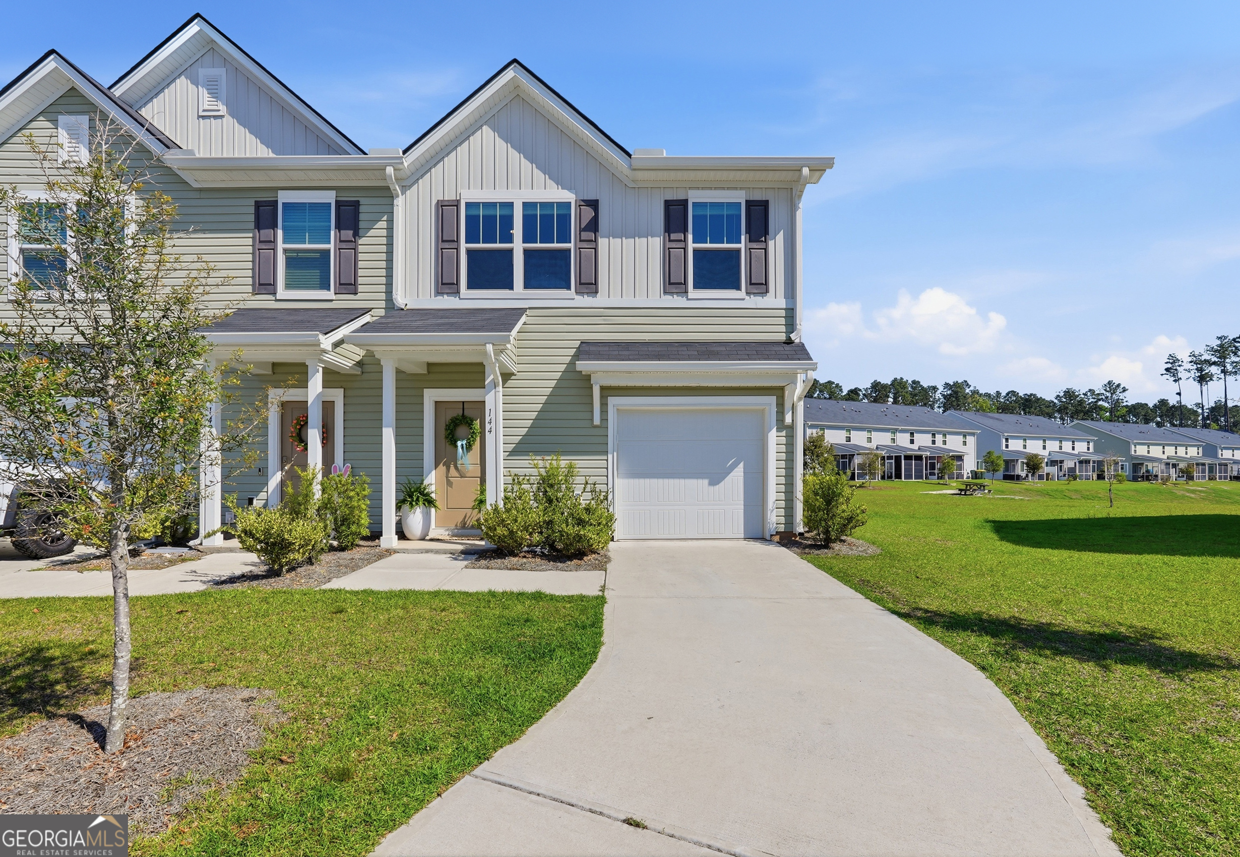 a front view of a house with a yard