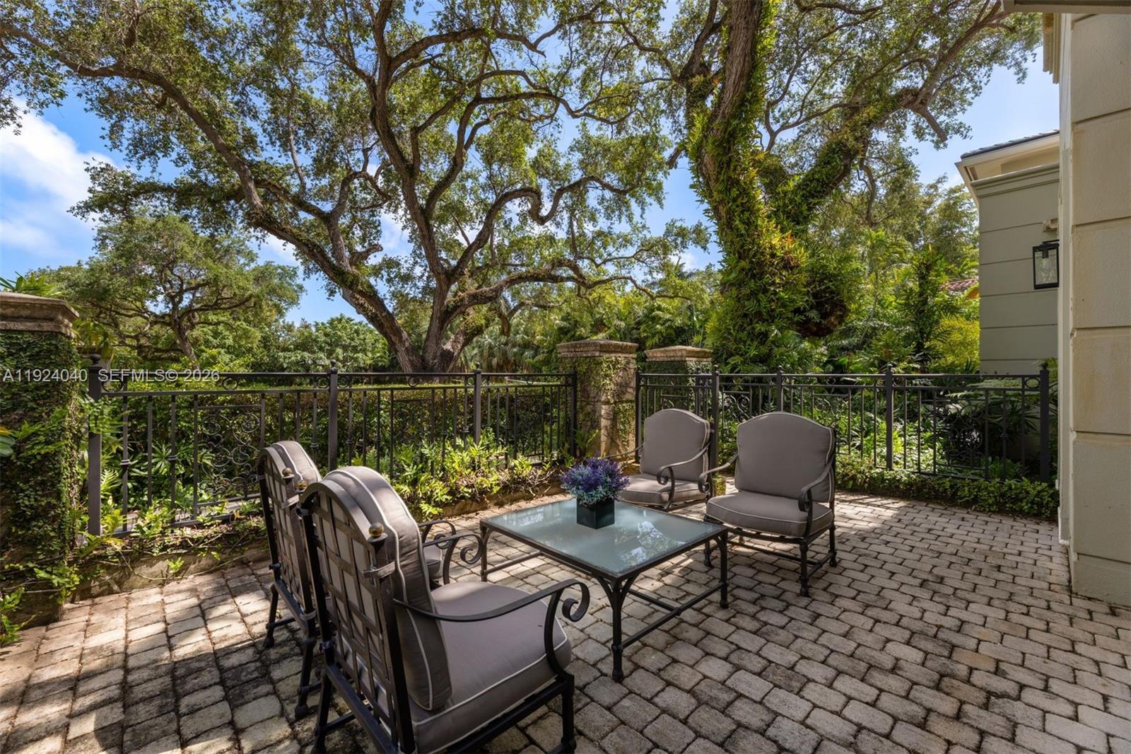 3460 South Moornings Way Miami, FL 33133 - Photo 13 of 29 a backyard of a house with outdoor seating
