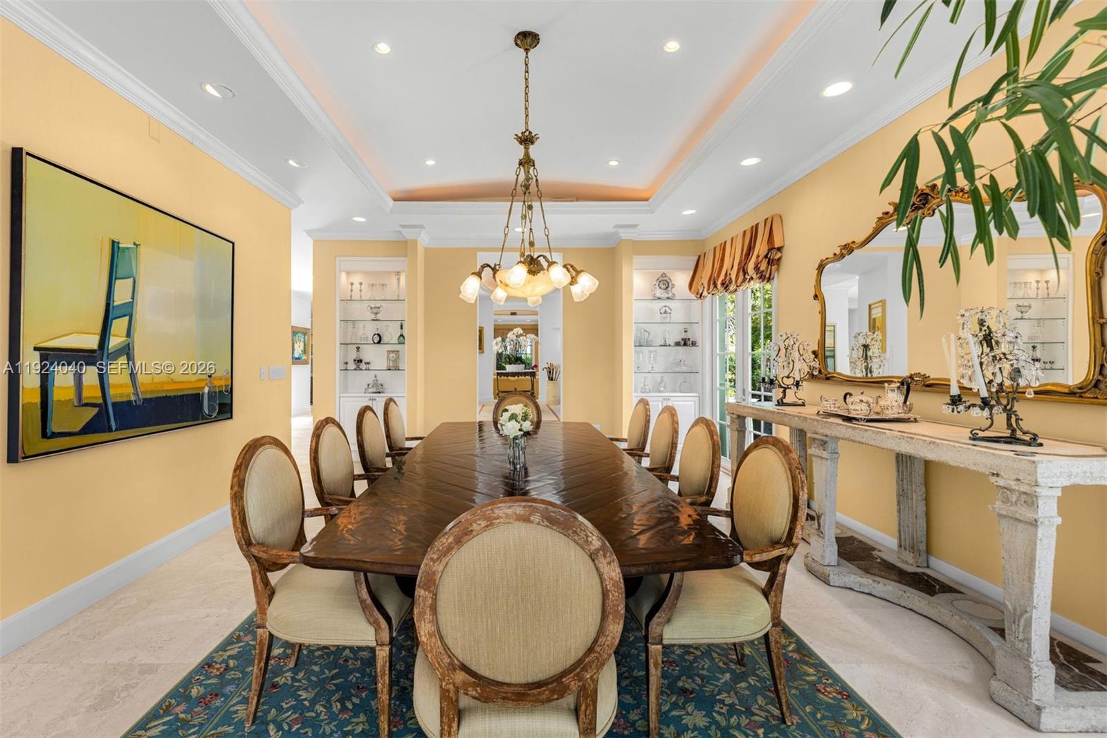 3460 South Moornings Way Miami, FL 33133 - Photo 18 of 29 a dining room with furniture a chandelier and window