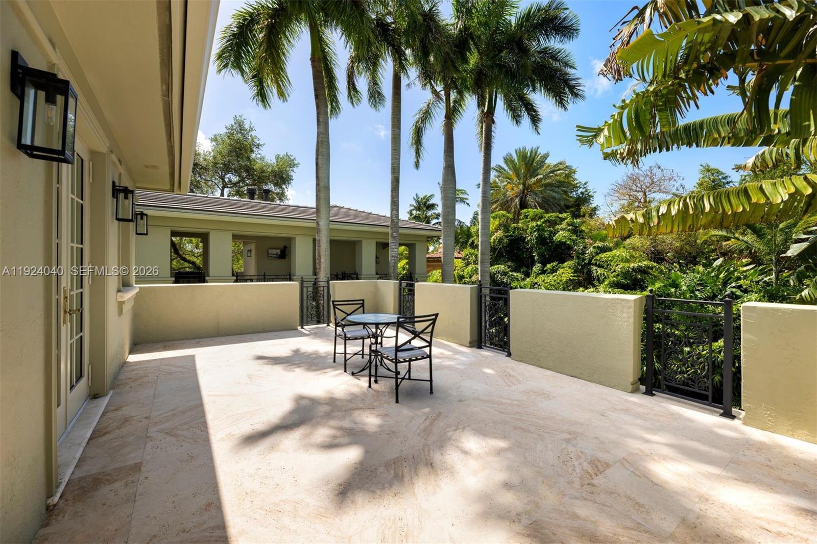 3460 South Moornings Way Miami, FL 33133 - Photo 20 of 29 a view of a patio with table and chairs and potted plants