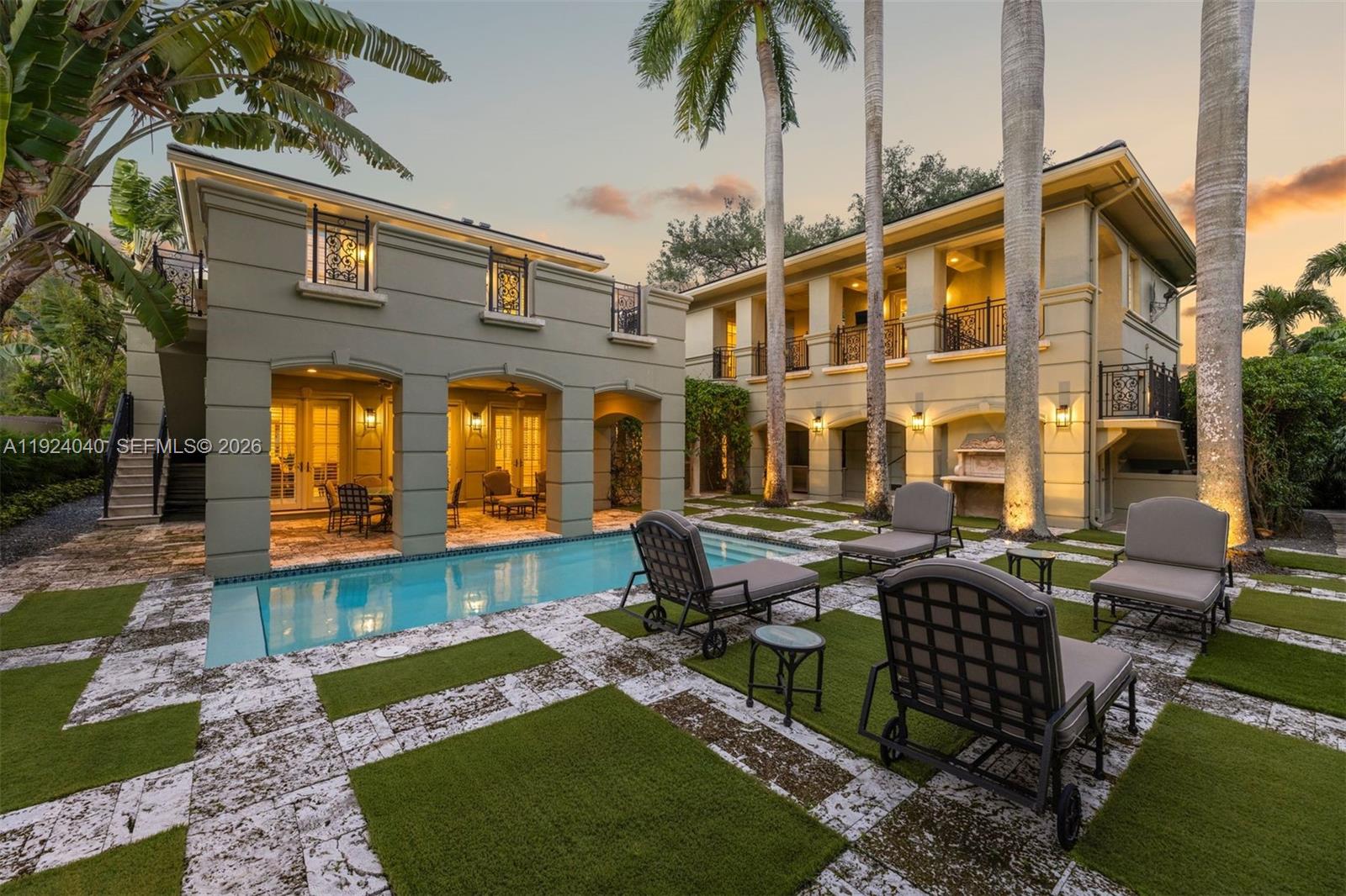 3460 South Moornings Way Miami, FL 33133 - Photo 22 of 29 a front view of a house with garden and outdoor seating