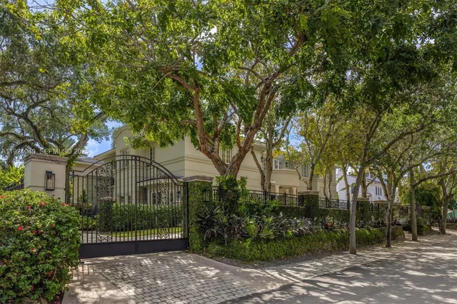 front view of a house with a tree