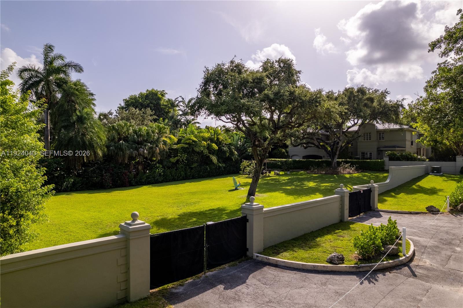 3460 South Moornings Way Miami, FL 33133 - Photo 29 of 29 a view of a swimming pool with a patio and a yard