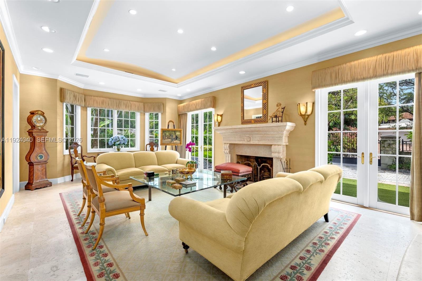 3460 South Moornings Way Miami, FL 33133 - Photo 4 of 29 a living room with fireplace furniture and a large window