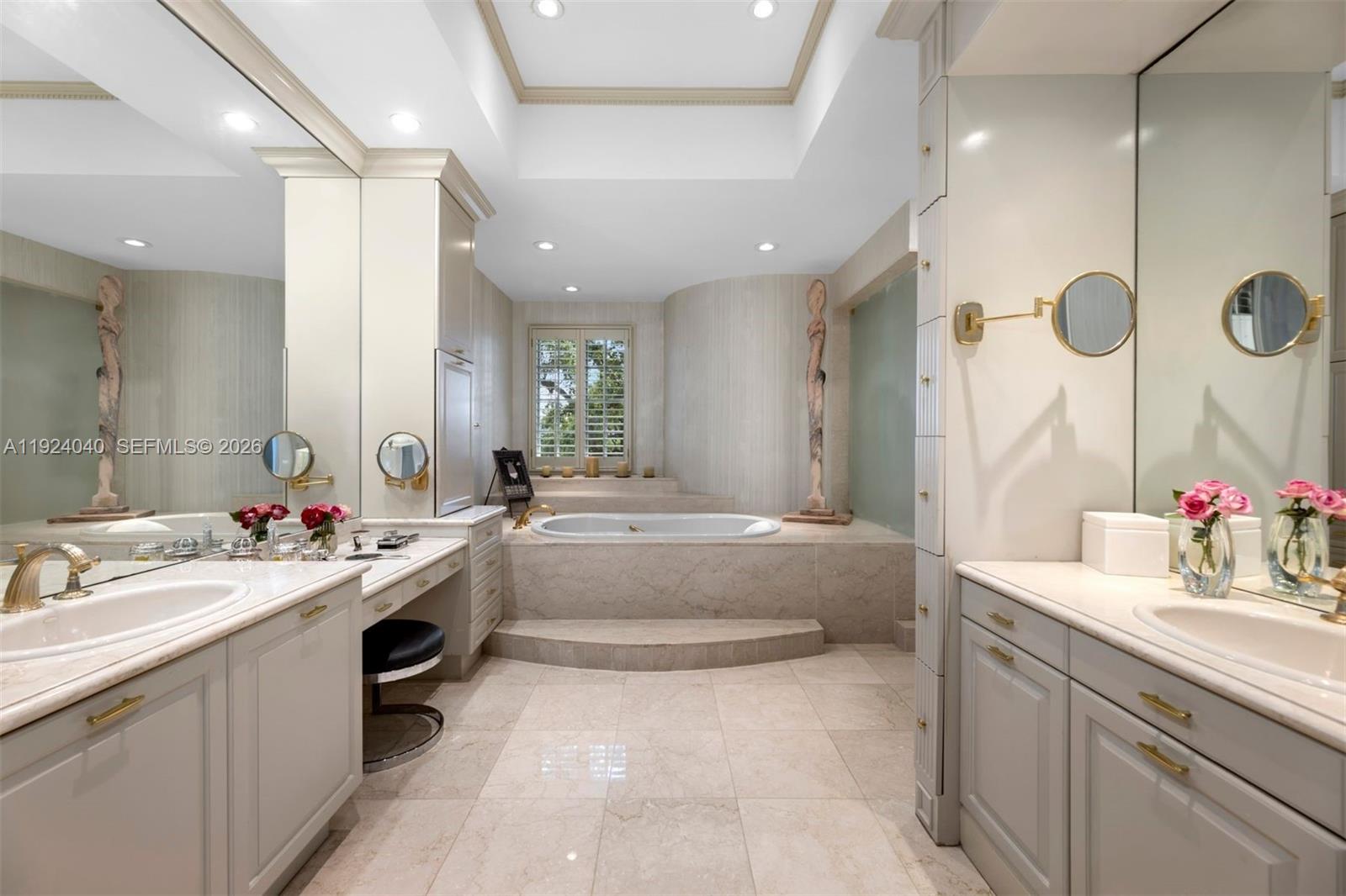 3460 South Moornings Way Miami, FL 33133 - Photo 9 of 29 a bathroom with a sink a vanity a mirror and a shower