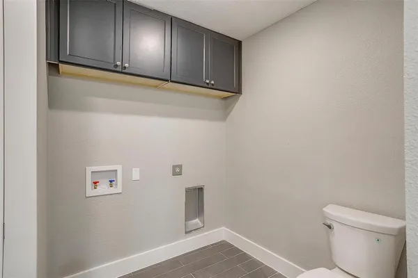 a view of a storage & utility room with wooden floor