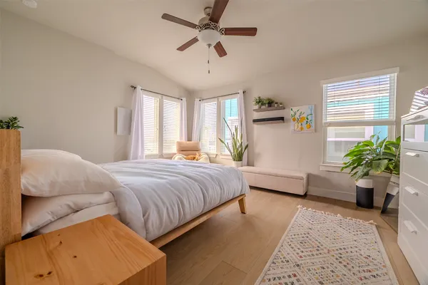 a bedroom with a balcony a bed and a couch