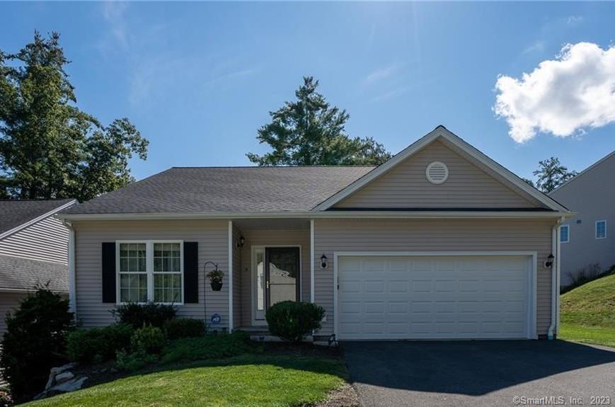 5 Steven's Boulevard Thomaston, CT 06787 - Photo 1 of 1 a front view of a house with a yard and garage