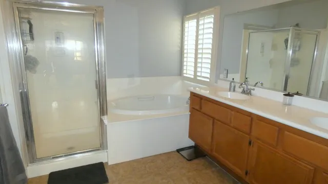 a bath room with a sink and a mirror