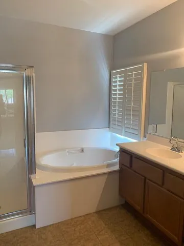 a bathroom with a bathtub and sink