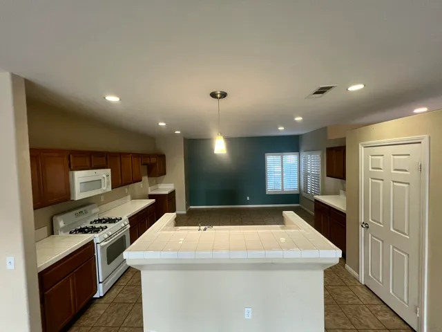 a kitchen with a stove and a sink