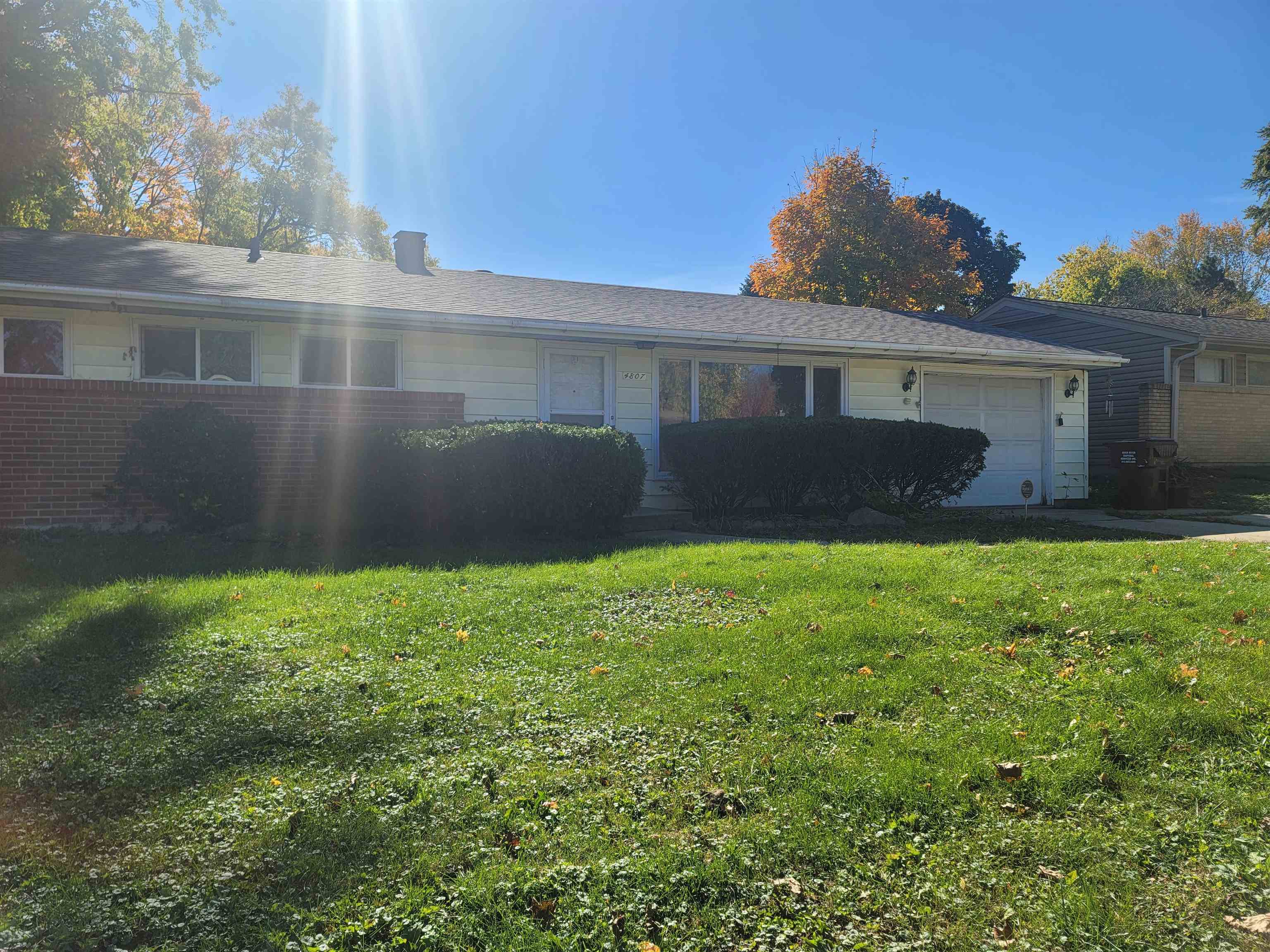 4807 Highcrest Road Rockford, IL 61107 - Photo 1 of 18 front view of house with a yard