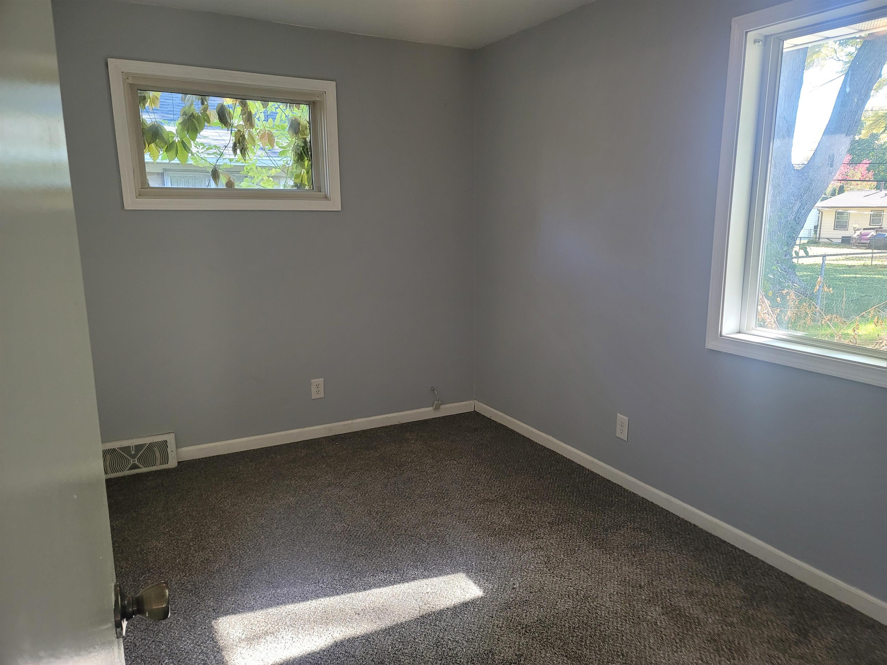 4807 Highcrest Road Rockford, IL 61107 - Photo 13 of 18 an empty room with windows