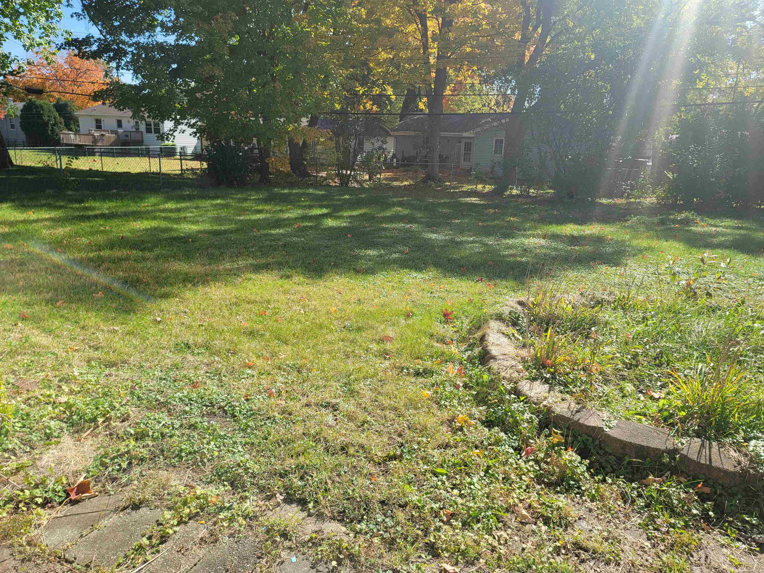 4807 Highcrest Road Rockford, IL 61107 - Photo 17 of 18 a view of outdoor space with deck and green space