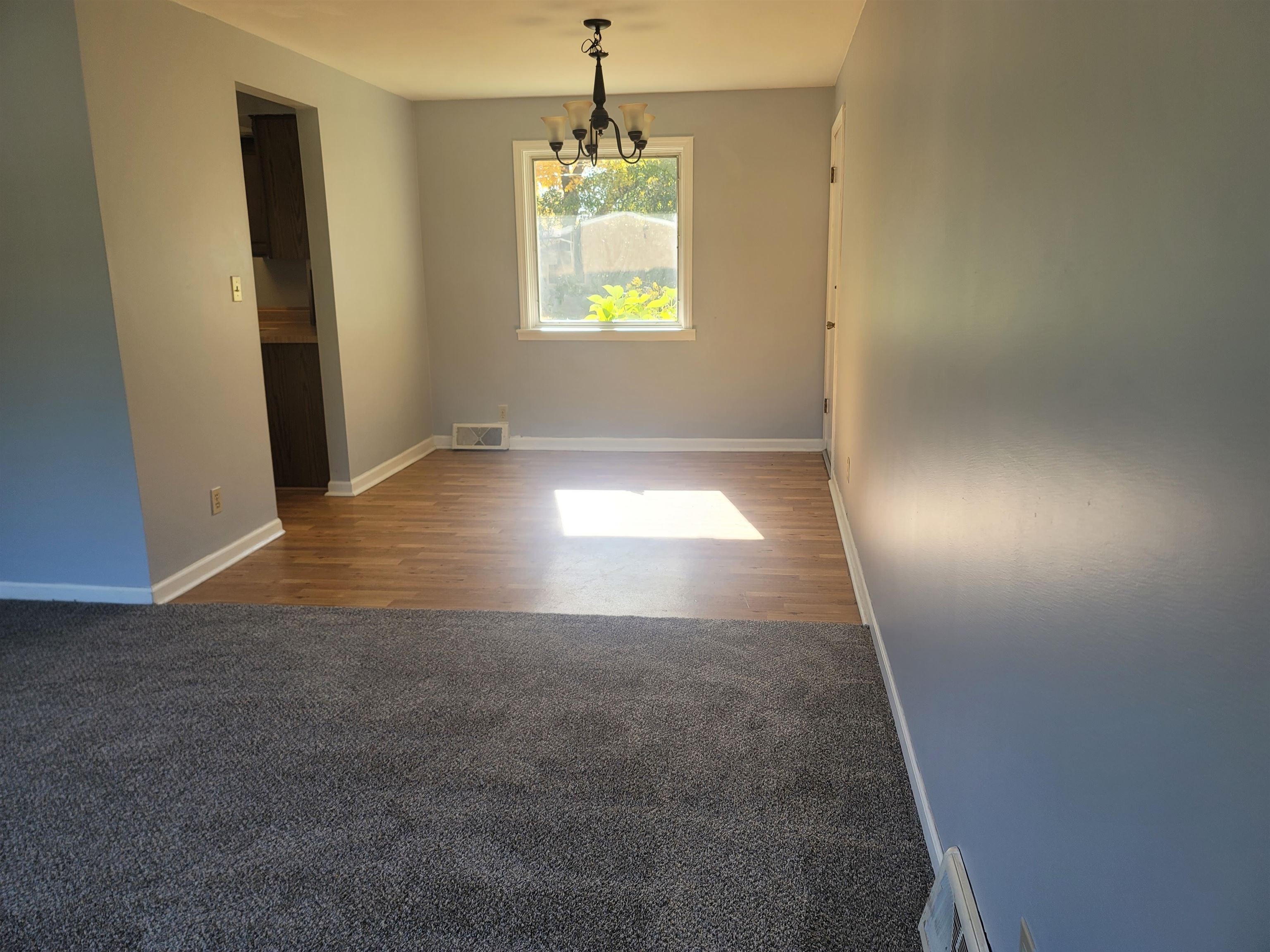 4807 Highcrest Road Rockford, IL 61107 - Photo 4 of 18 an empty room with windows and entrance