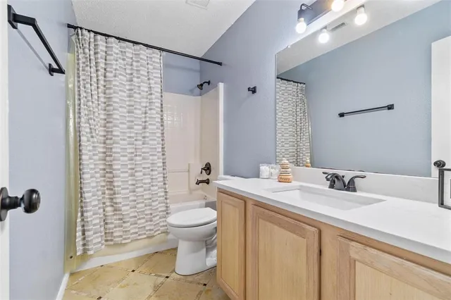 an aerial view of a house with swimming pool