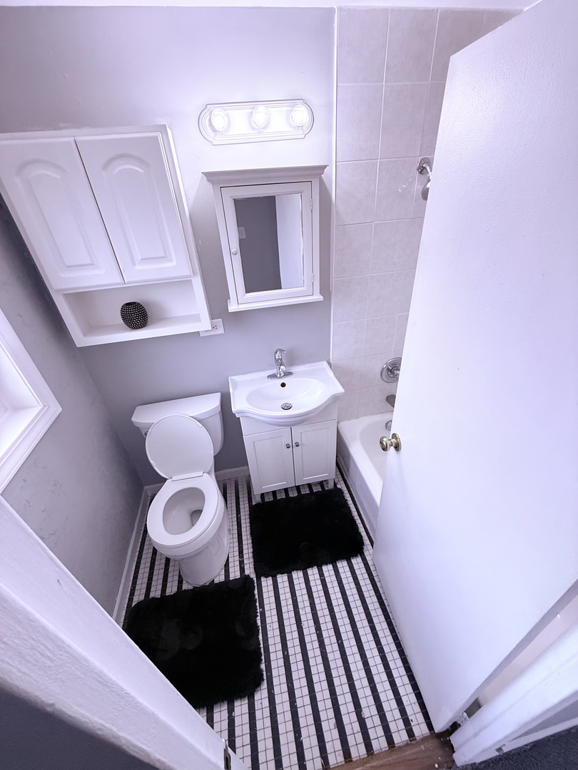 32 Dunlap Road Park Forest, IL 60466 - Photo 11 of 11 a bathroom with a sink and a mirror