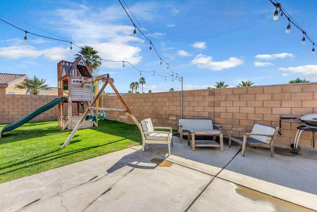 84285 Tramonto Way Indio, CA 92203 - Photo 34 of 63 a view of a patio with a table and chairs