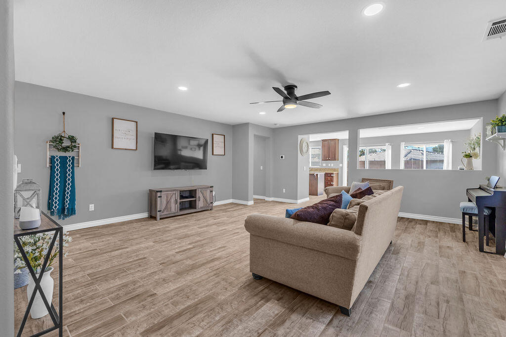 84285 Tramonto Way Indio, CA 92203 - Photo 5 of 63 a living room with furniture and a flat screen tv